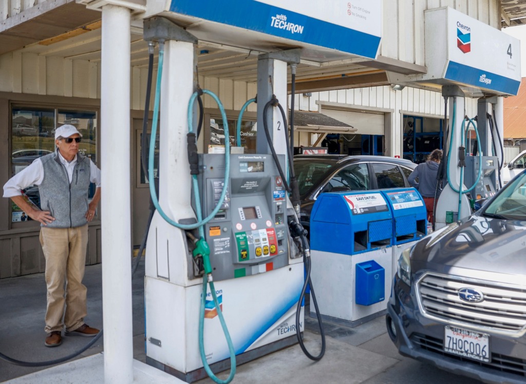 Average US gas price dips below $5 a gallon